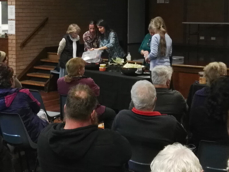 Gillian Kozicki demonstrating how to make sauerkraut