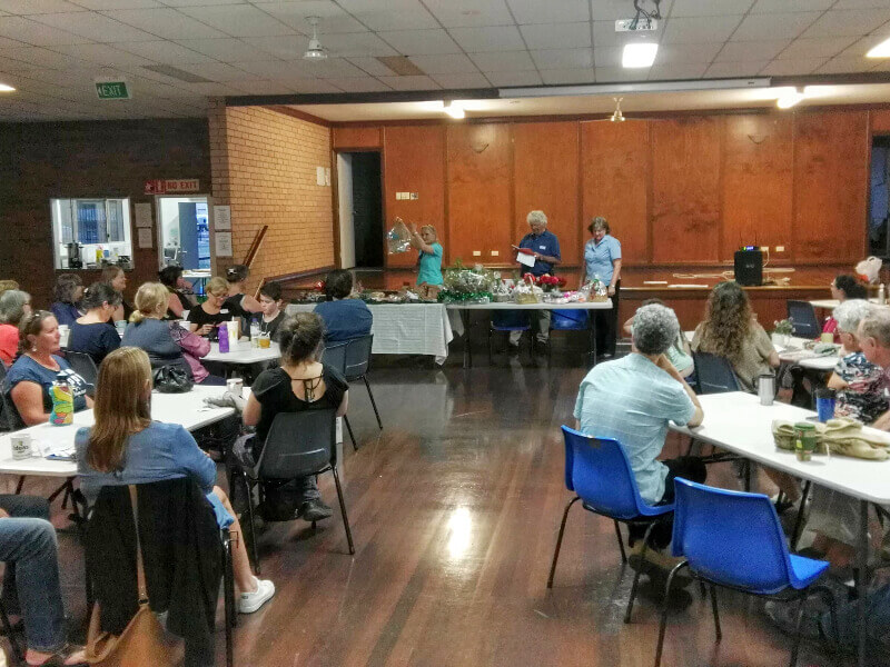 PCC members sitting around tables at the Tuggerah Hall