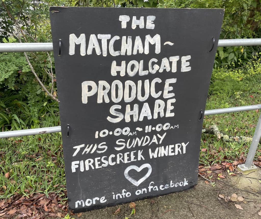 Hand-painted blackboard advertising the Produce Share
