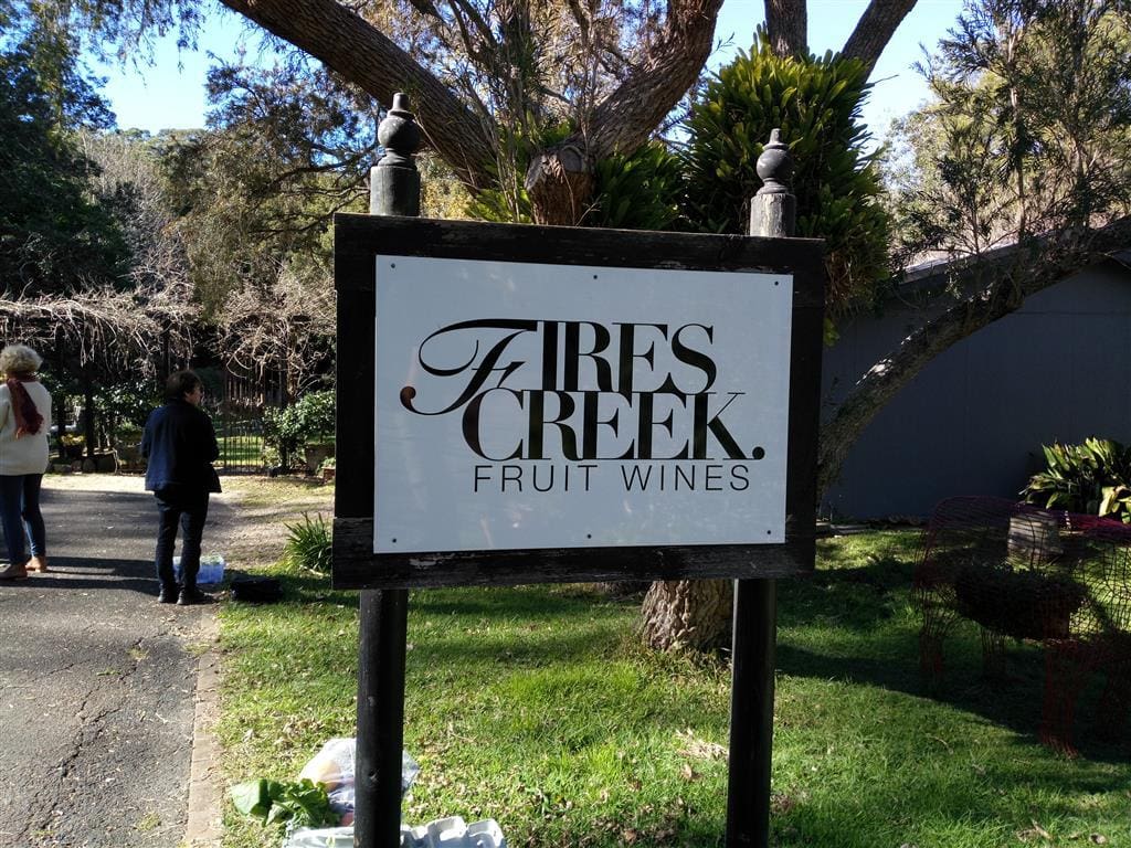 Wooden sign that says Firescreek Fruit Wines
