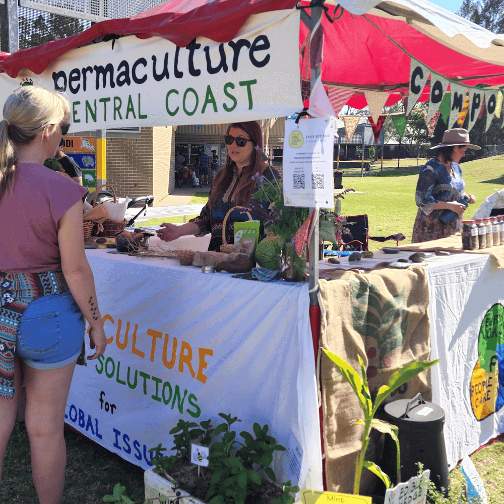 Clara talking to a visitor at the PCC stand